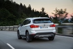 2019 BMW X1 xDrive28i in Alpine White - Driving Rear Left View